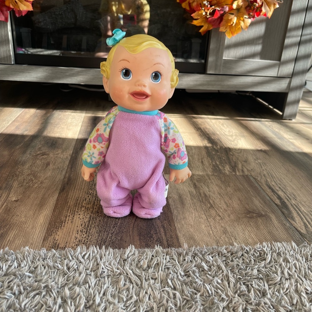 Adorable Baby Doll with Purple Outfit